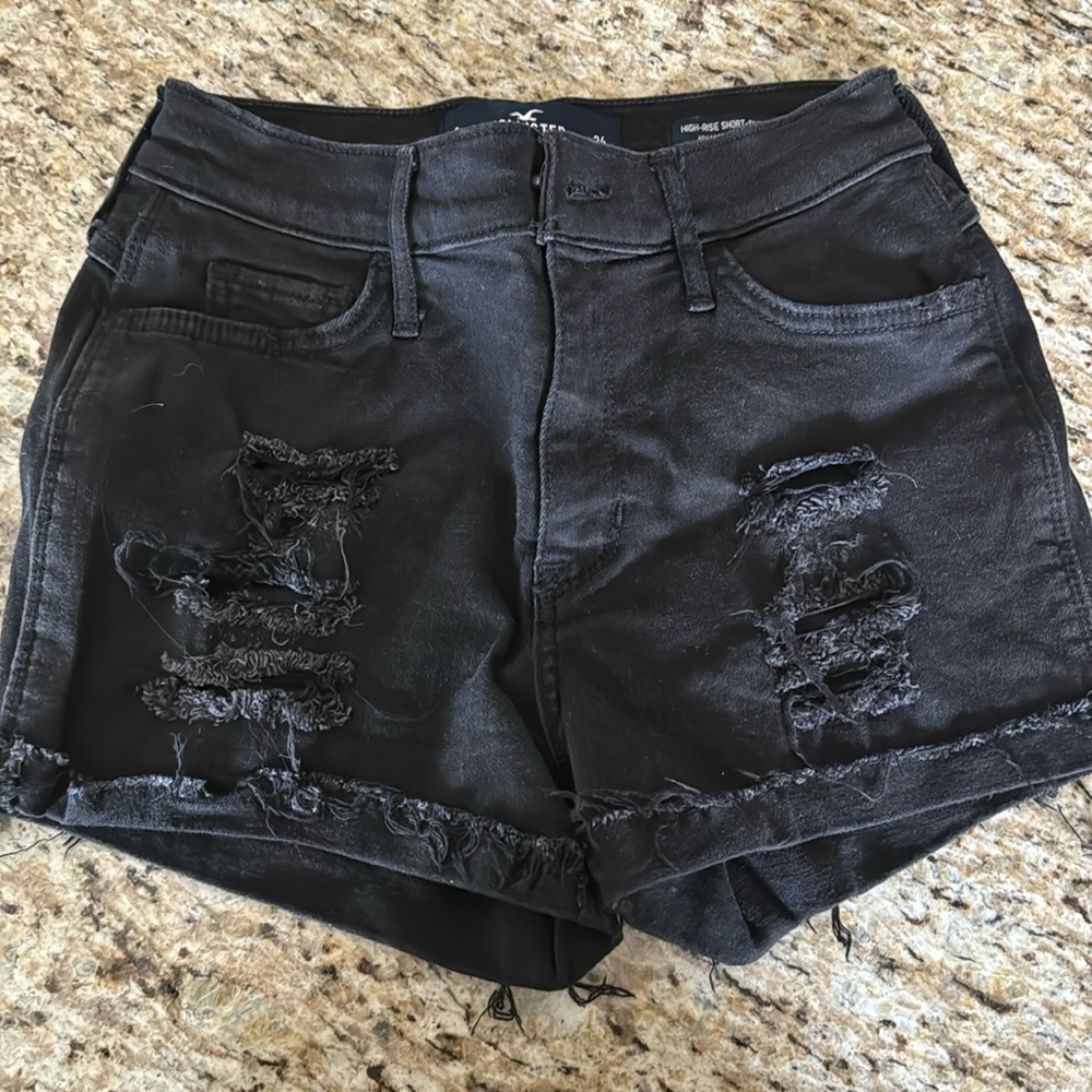 black ripped shorts